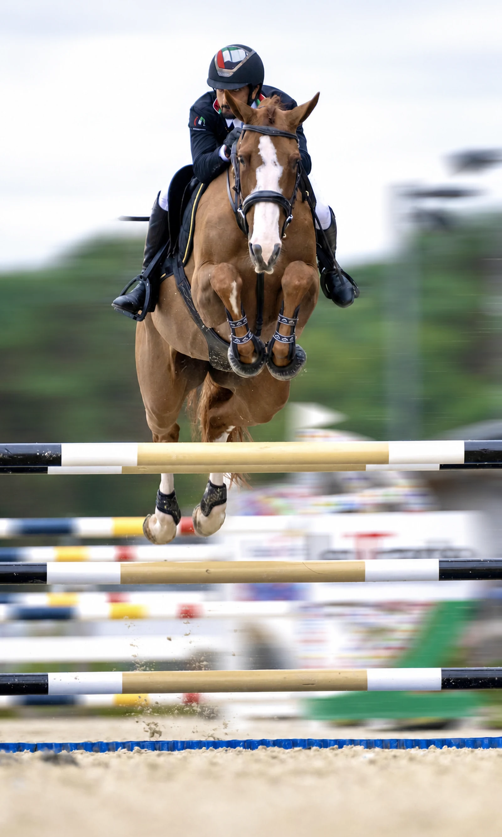 Sheikh Rashid bin Ahmed Al Maktoum competing in show jumping