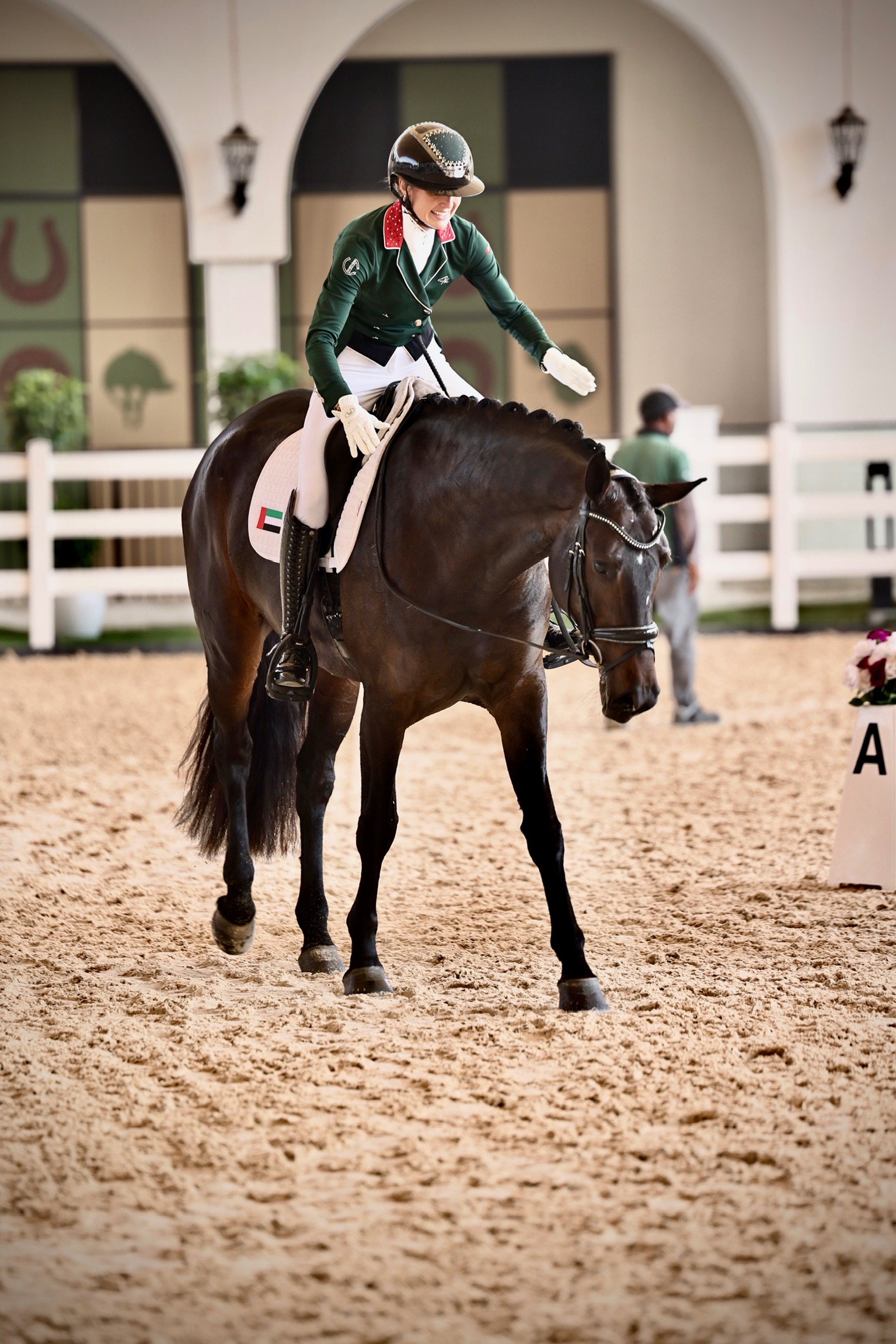 Natalie Lankester riding in a dressage arena